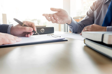 Businessman conducting an interview with businessman in an office