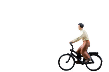 Fototapeta na wymiar Miniature figure ride bicycle isolated on white background with clipping path