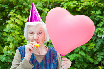 Elderly woman celebrating birthday