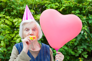 Elderly woman celebrating birthday
