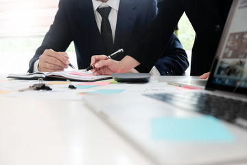 Audit concept,Bookkeeper Team or financial inspector and secretary making report Financial Planning Accounting Report in Spreadsheet . Internal Revenue Service inspector checking financial document.