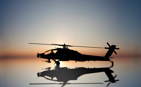 apache helicopter on the sun set