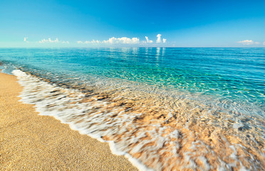 Sea view from tropical beach with sunny sky. Summer paradise beach. Tropical shore. Tropical sea. Exotic summer beach with clouds on horizon. Ocean beach relax, outdoor travel