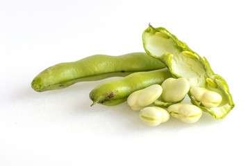 put on a white background bean pods dehulled beans