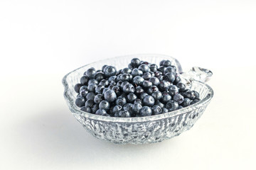 on a white background in a delicious blue bilberries