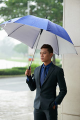 Handsome Asian Gentleman Waiting in Rain
