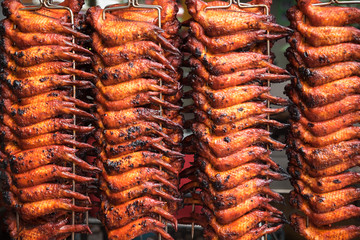 Close up rows of grilled chicken wings on the food market in Kota Kinabalu. Travel Malaysia
