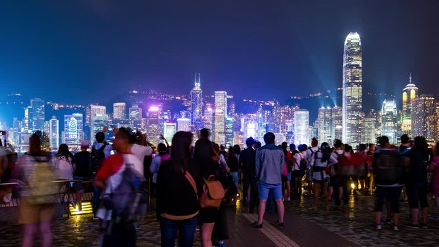 Tsim Sha Tsui, Hong Kong, 26 May 2017 -: Crowded of people enjoy the show of A Symphony of Lights in Hong Kong at night