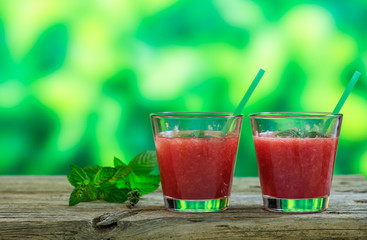 Watermelon juices on a wooden table