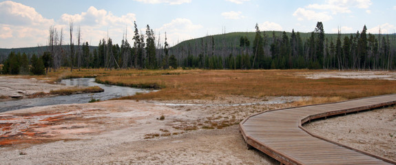 Wooden Observation Walkway next to Iron Spring Creek in Black Sand Geyser Basin in Yellowstone...