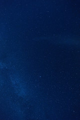 Fototapeta premium Milky way stars photographed with wide-angle lens. 