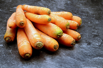 Carrot on a black background close up photo