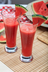 Watermelon juices preparation on a wooden table