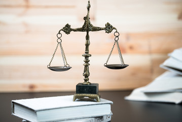 Symbols for balance and power in law and court, selected focus, narrow depth of field