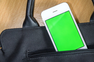Smart phone in bage pocket with green black screen for text or picture. Concecpt for advertising,...