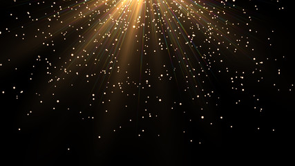 Sprinkle gold dust on a black background with copy space.