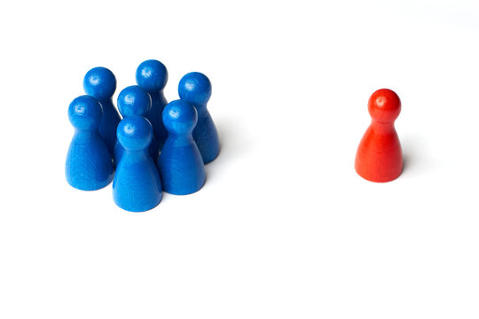 One Group of seven blue people and one red person. Game figure concept.