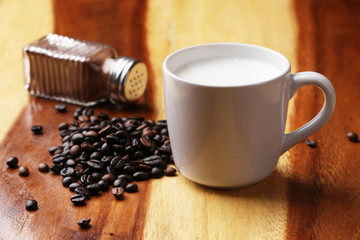 Hot latte , hot coffee and milk foam on wood floor