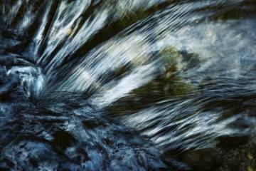 Detail of a dark ripple on the river