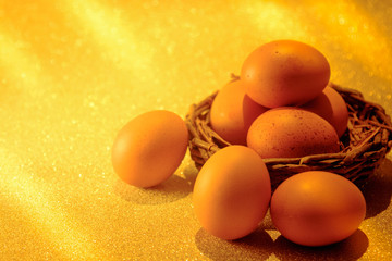 Fresh Eggs on golden light of golden bokeh background.  Golden heaven light Hope and success concept