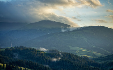 Storm clouds over mountains and the forest