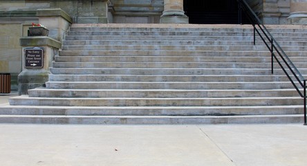The cement steps going up to the building.