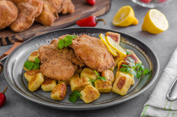 Schnitzel original with lemon and gnocchi fried