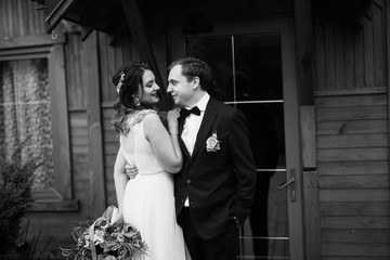 Elegant wedding couple in the autumn park