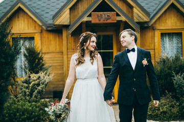 Elegant wedding couple in the autumn park