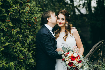 Elegant wedding couple in the autumn park