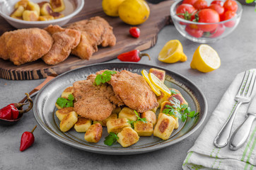 Schnitzel original with lemon and gnocchi fried