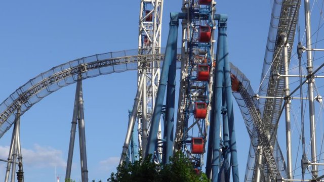 Ferris wheel and roller coaster - video 4K UHD