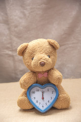 Teddy bear with clock