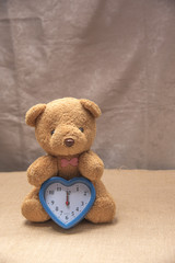Teddy bear with clock