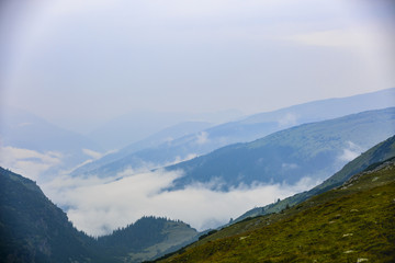 Obraz premium Beautiful mountain scenery with clouds above