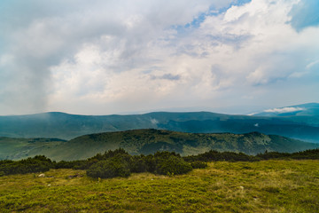 Fototapeta premium Beautiful mountain scenery with clouds above