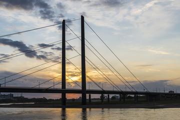 Fototapeta na wymiar Oberkassel bridge at sunset in Dusseldorf, Germany