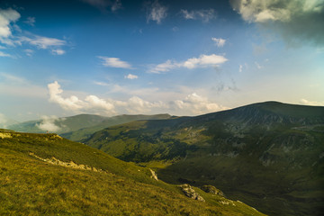 Fototapeta premium Beautiful mountain scenery with clouds above