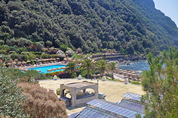 View of the thermal complex with swimming pools under the open sky and the sea