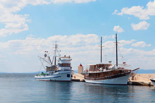Two ships in the harbor of a small town - Croatia, island Brac
