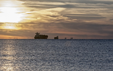 Mystical sunset on the Baltic Sea. The water area of the port of Klaipeda, Lithuania