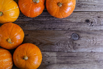Fresh farm pumpkins on a wooden table