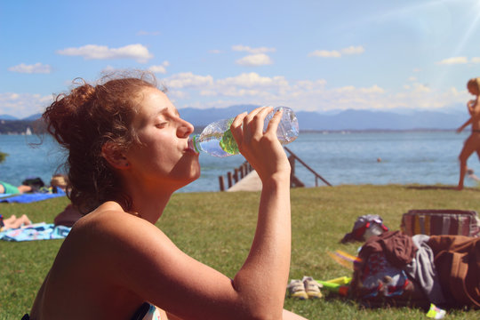 Young woman drinking refreshing water