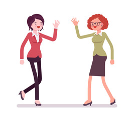 Businesswomen greeting with hands