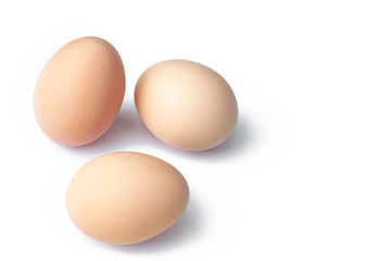 Three uncooked eggs isolated on white