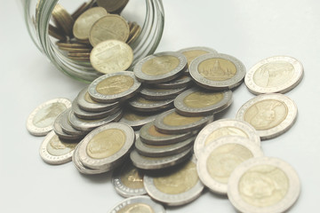 Saving the Coins of thailand on a white background