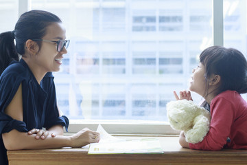 happy time ,asia mother and daughter talking and they are  smiling together, family lifestyle
