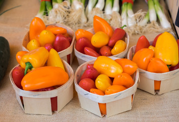 Small red and orange bell pepperss for sale at local market in Provence region. France
