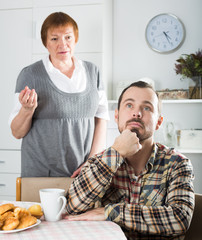 Elderly mother teaches her son