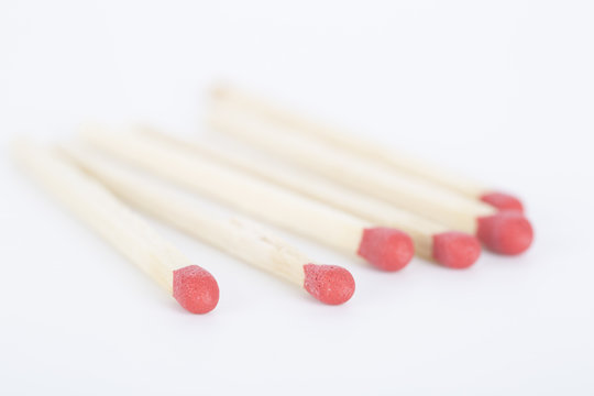A bunch of matches isolated on white. Closeup.